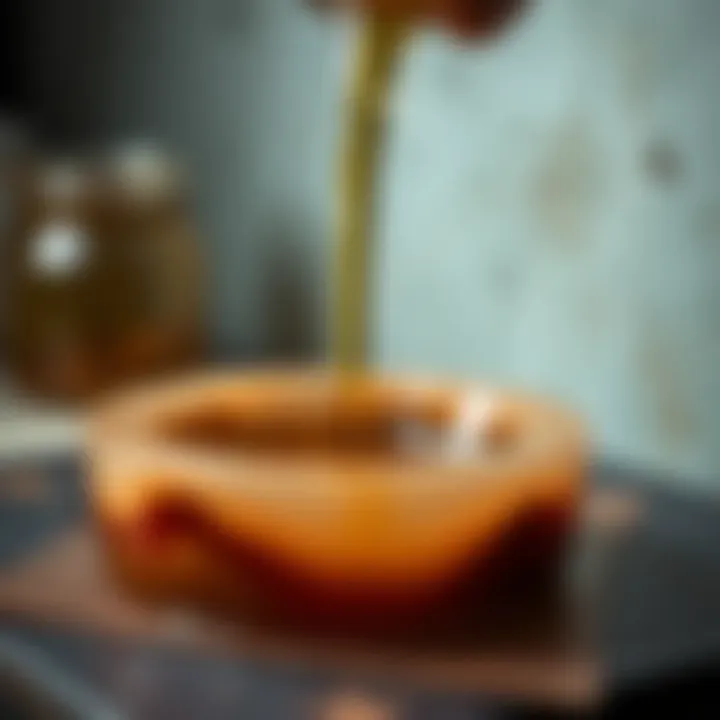 A close-up view of epoxy resin pouring into a mold for artistic projects.