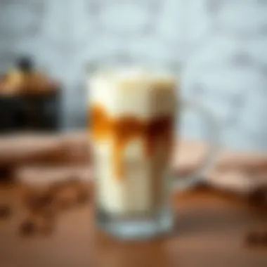 Close-up of a stylish glass filled with cold coffee and cream