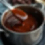 Rich chocolate sauce simmering in a saucepan